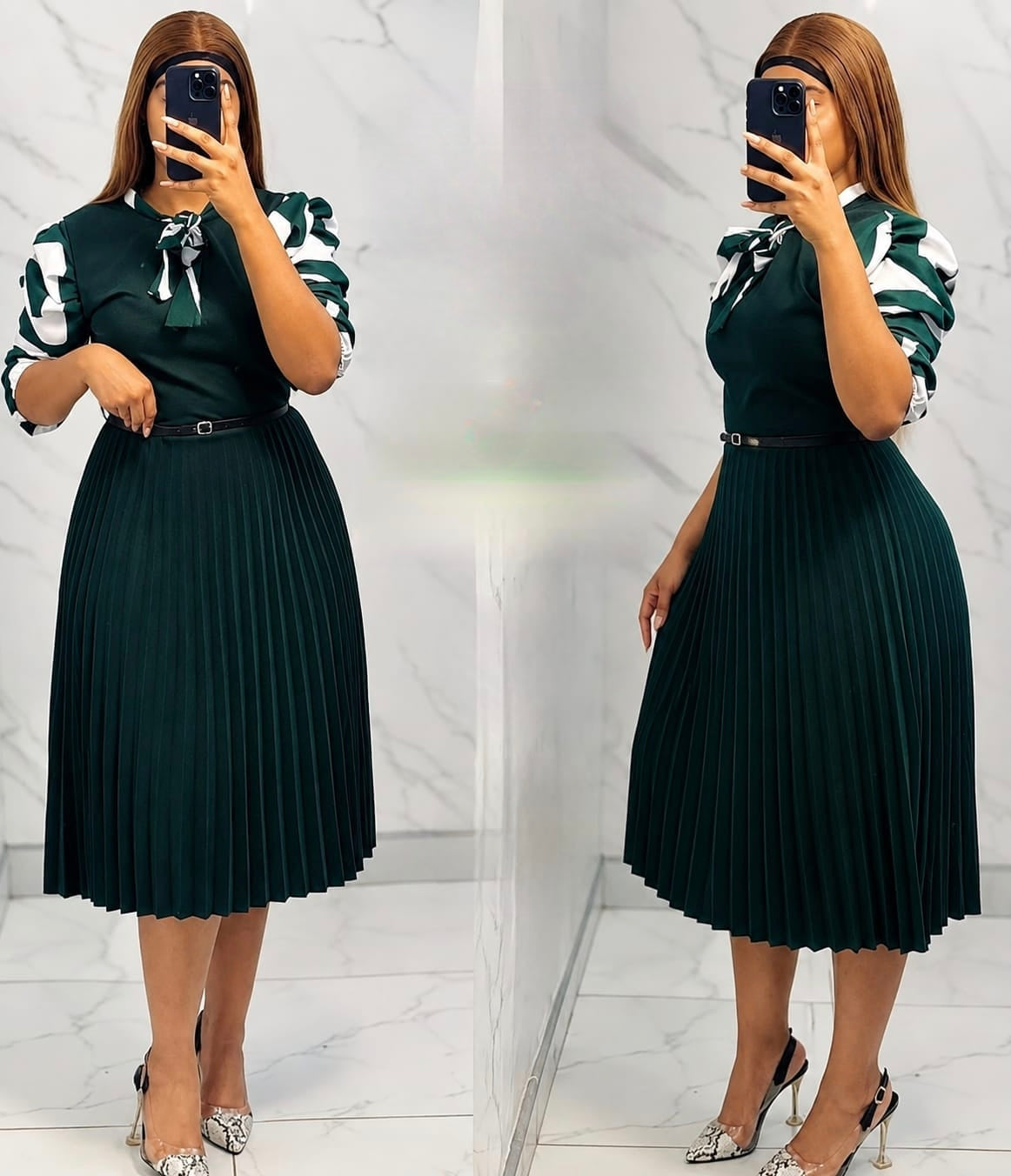 Puff sleeve pleated midi dress in dark green with a defined waistline and flowing skirt.