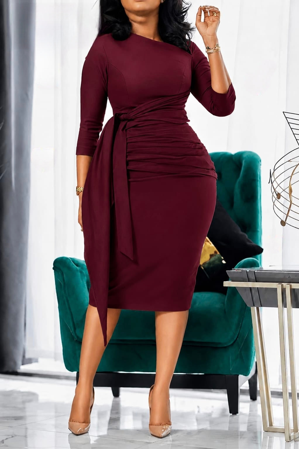 Burgundy Elegant Ruched Waist Midi Dress with three-quarter sleeves, flowing side sash, and model wearing heels.