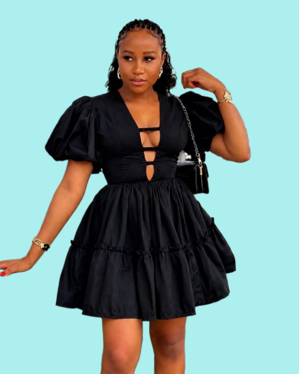 Black puff sleeve mini dress with a deep V-neckline and tiered ruffle skirt, showcasing a fitted waist.