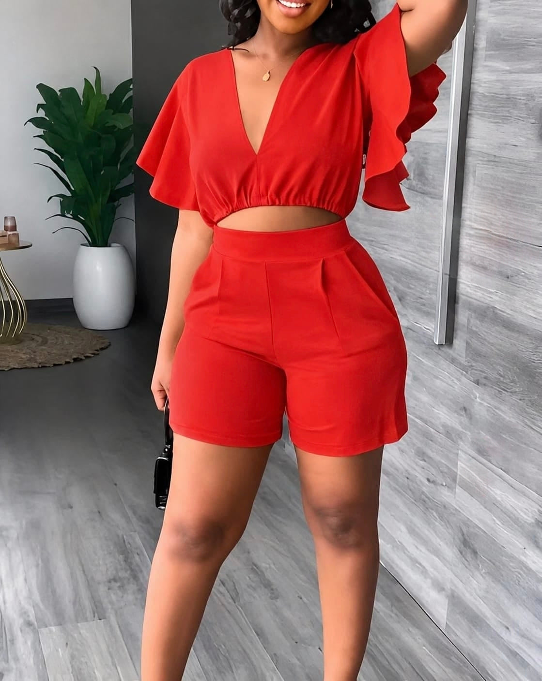 Two-piece Flutter Sleeve Crop and High-Waist Shorts Set in a solid color, featuring a deep V-neckline and front pleats.