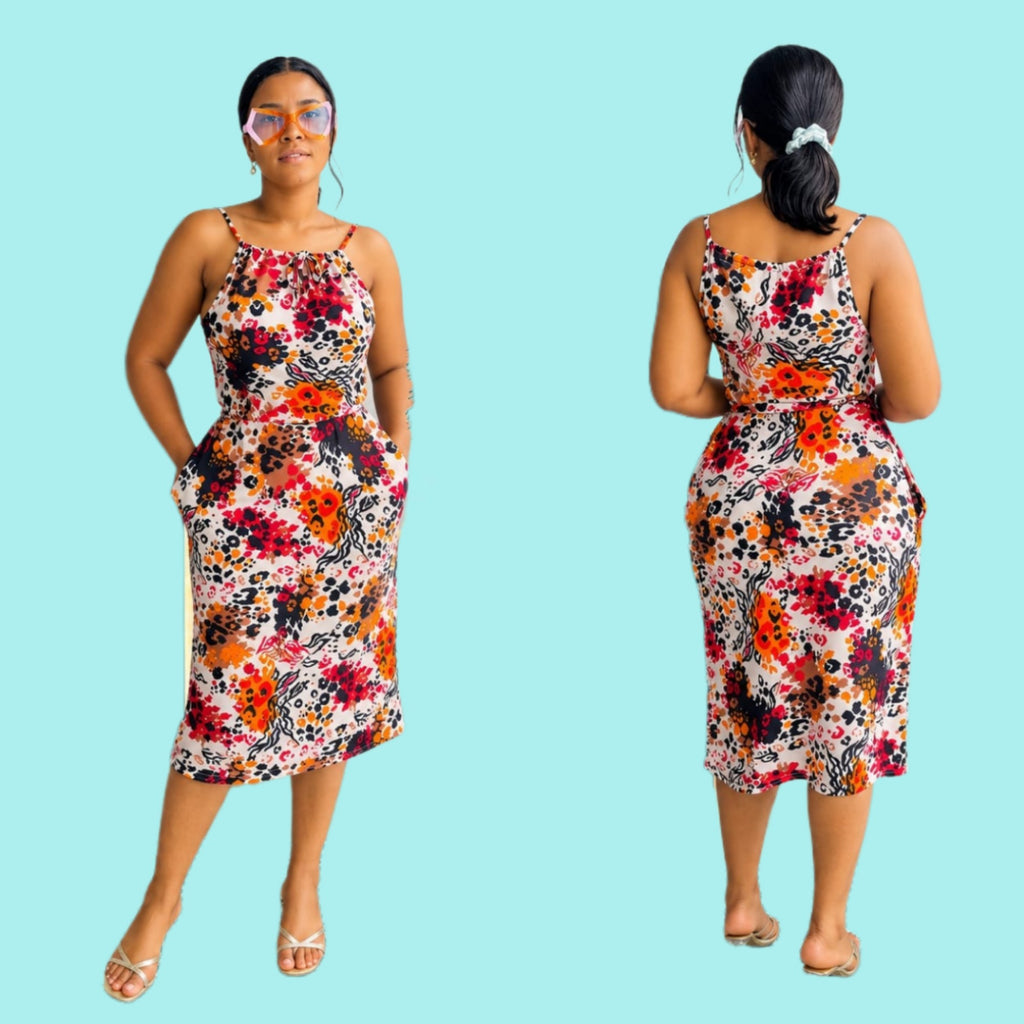 Fitted bodycon midi dress with floral print, spaghetti straps, and side pockets, perfect for summer outings.