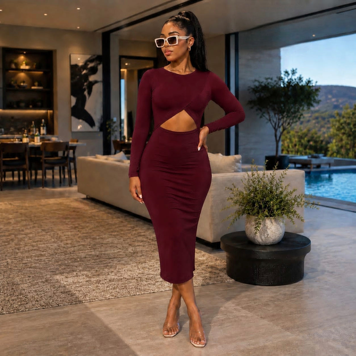 Burgundy bodycon midi dress with crossover wrap front and triangular keyhole cut-out, featuring long sleeves.