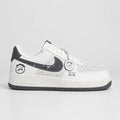 White and grey Nike Air Force 1 Low with charcoal Swoosh, smiley graphics and bottle-cap keychain | Ovadue