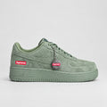 Olive green suede Nike Air Force 1 Low with Supreme box logo and silver bottle-cap keychain | Ovadue
