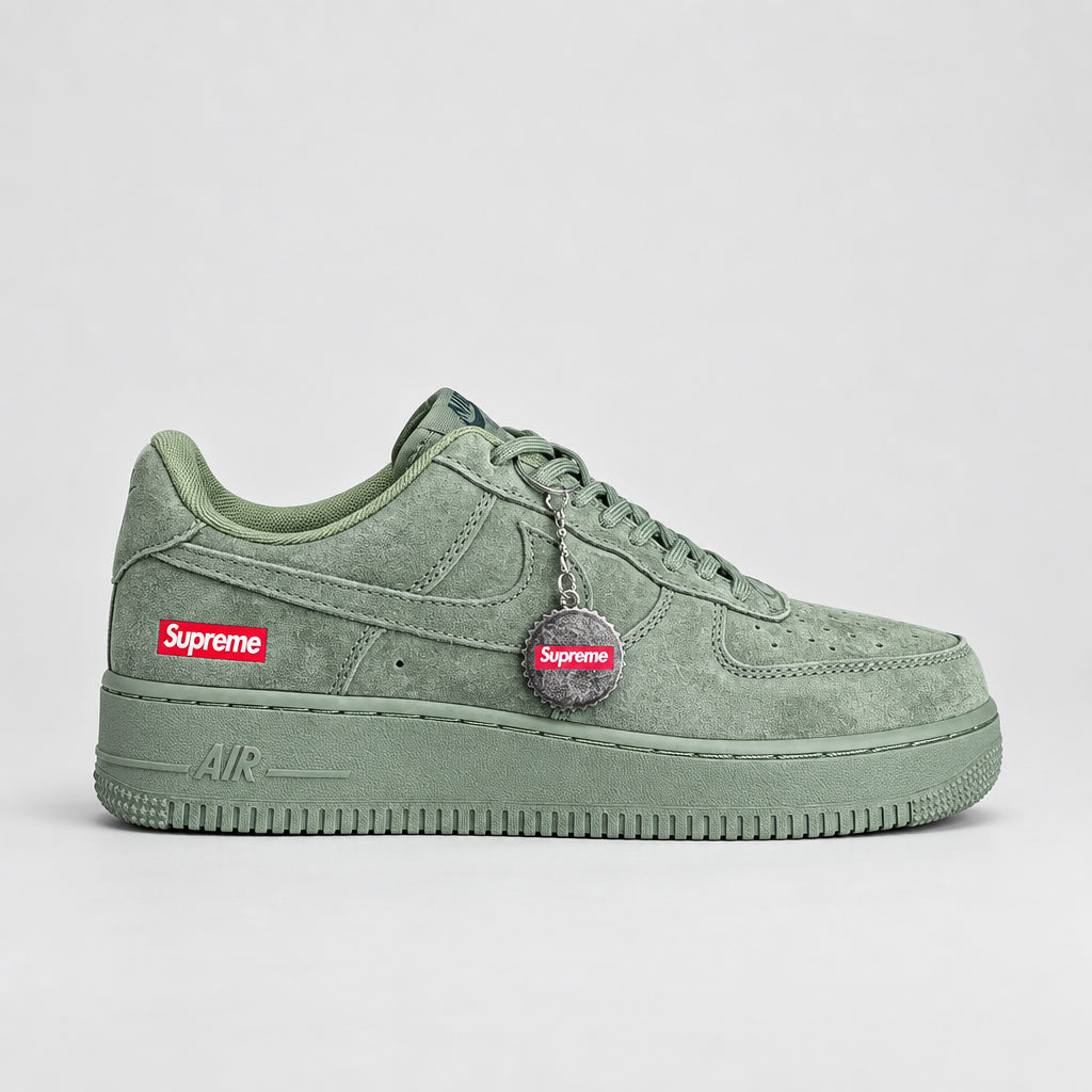 Olive green suede Nike Air Force 1 Low with Supreme box logo and silver bottle-cap keychain | Ovadue