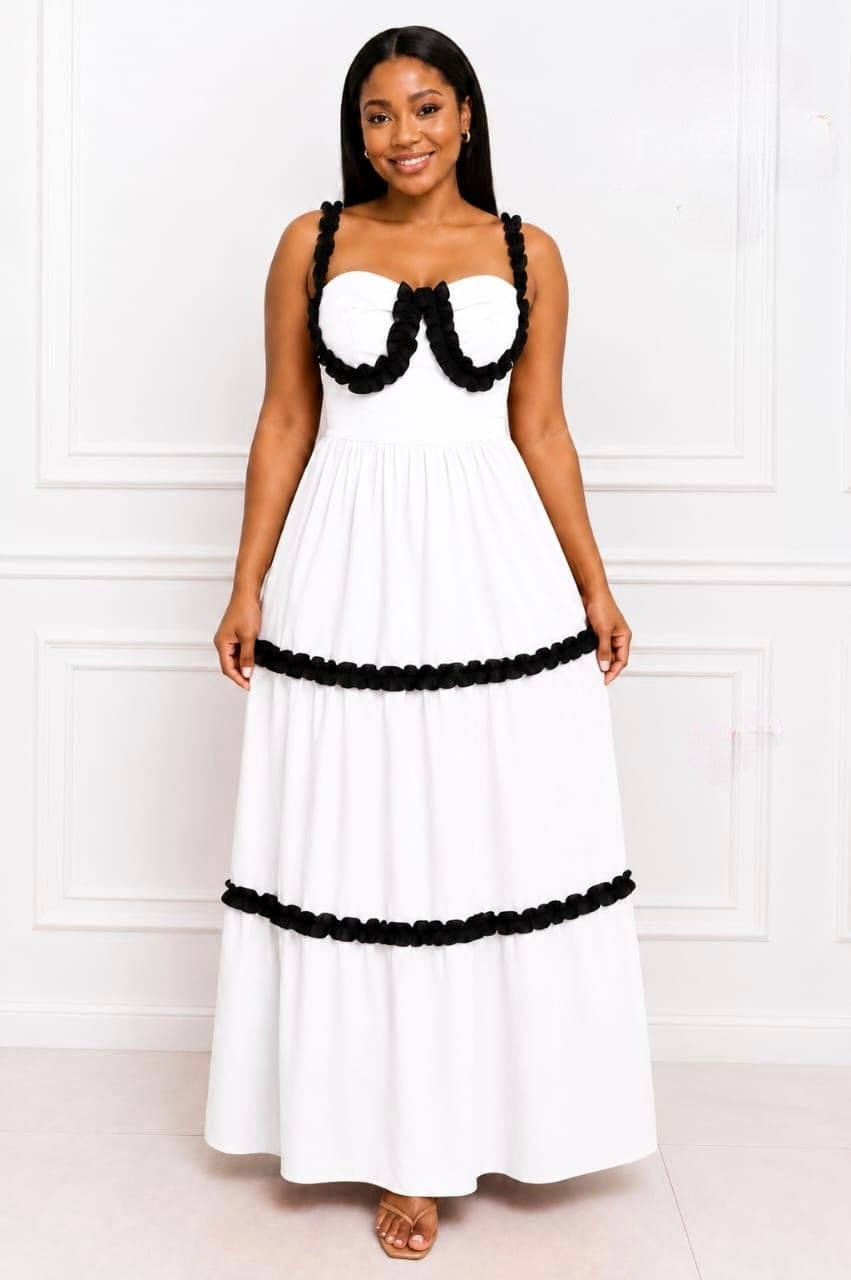 Structured bodice with ruffle detailing and a flowing tiered skirt in a floor-length maxi dress.