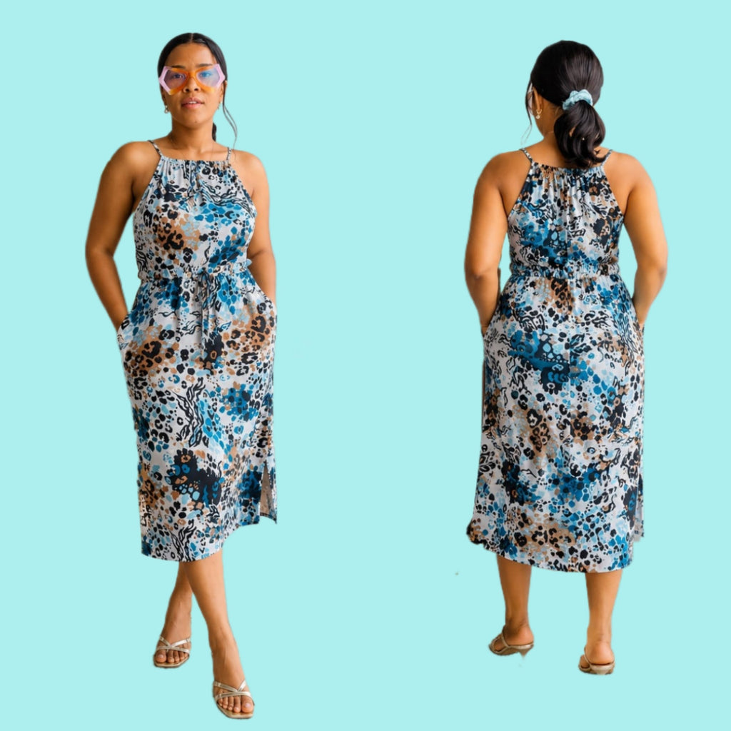 Fitted bodycon midi dress with floral and abstract animal print, thin spaghetti straps, and side pockets.