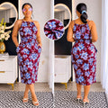 Floral print dress with blue and white flowers on burgundy, halter neck, spaghetti straps, elasticated waist, mid-calf length, pockets.