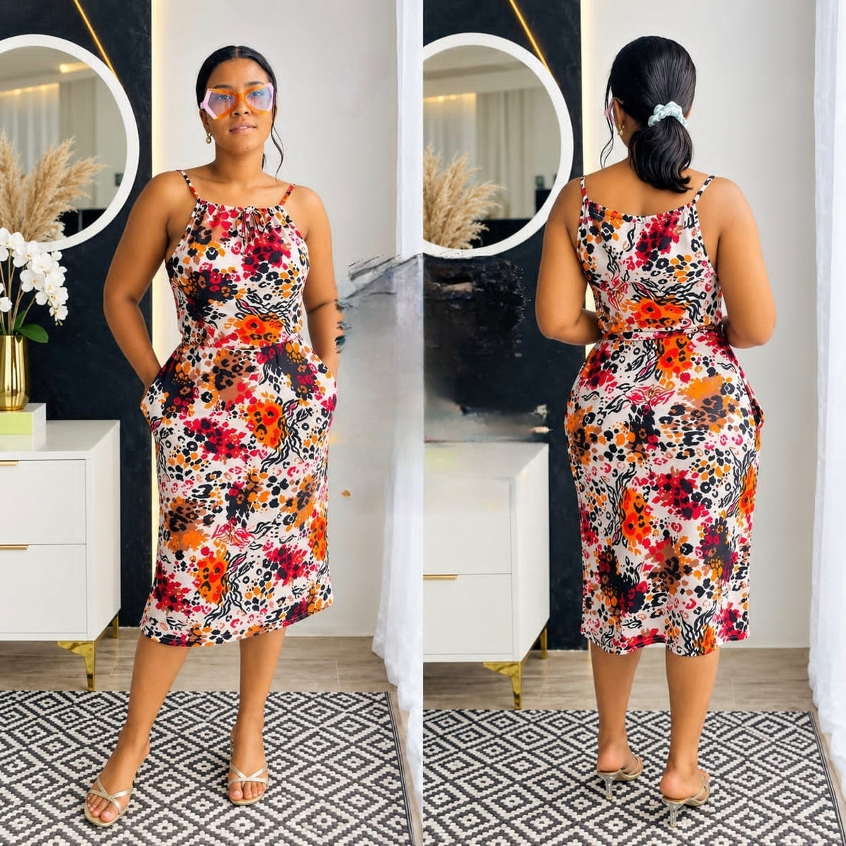 Floral print sleeveless midi dress with halter neck, fitted silhouette, and side pockets.