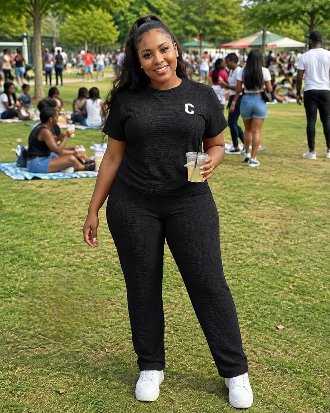 Model wearing the Textured Two-Piece Lounge Set KT featuring a short-sleeve top with a 'C' emblem and straight-leg pants.